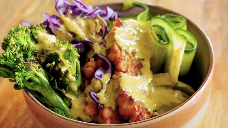 Crispy tempeh nourish bowl with green goddess kimchi dressing & charred broccoli